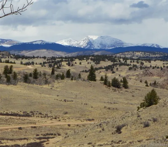 a view of a large mountain with a lake view