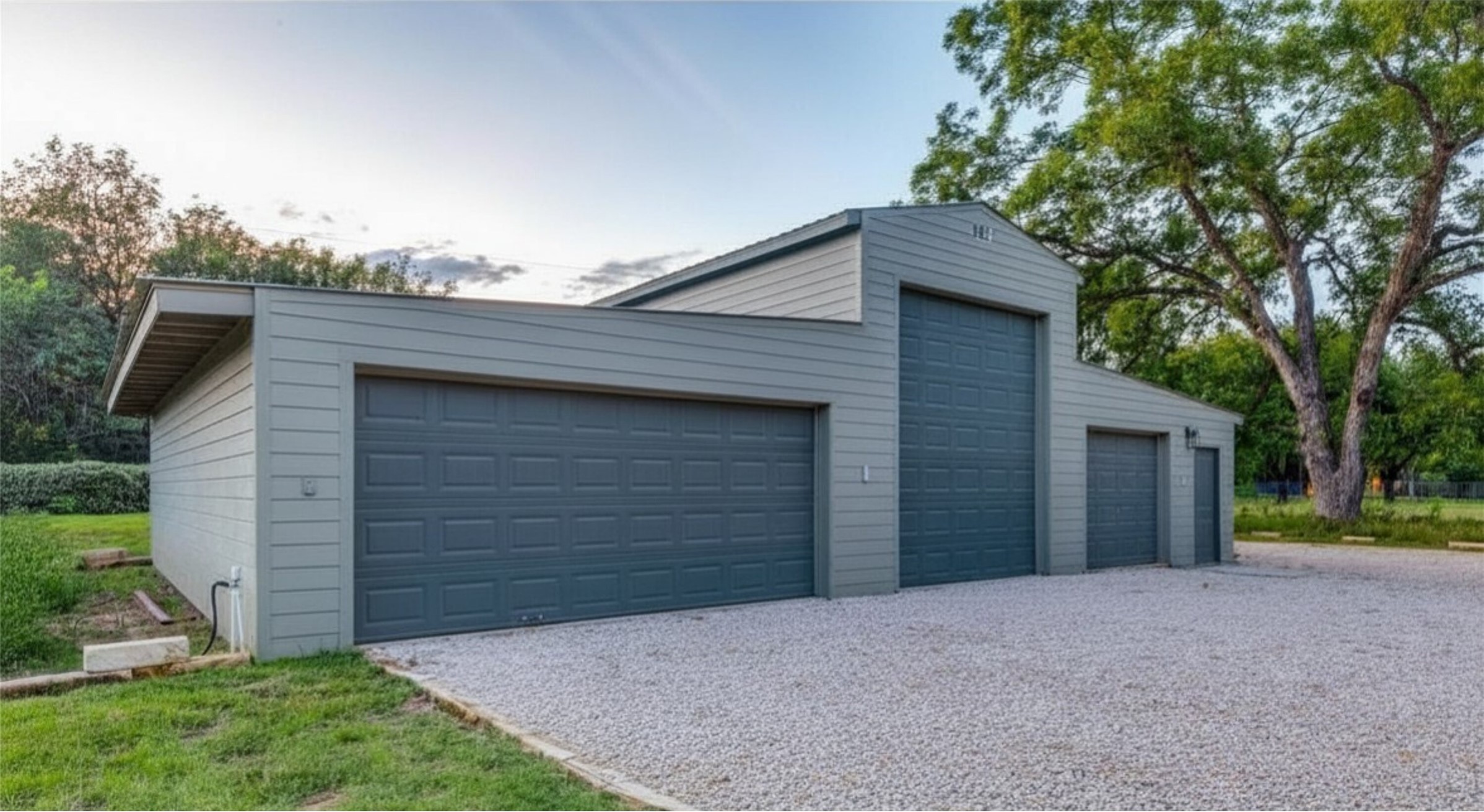 303 Lago Verde Road Austin, TX 78734 - Photo 4 of 39 A spacious multi-bay garage offers ample vehicle storage space