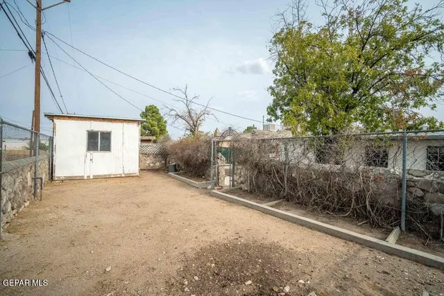 a view of a house with a tree