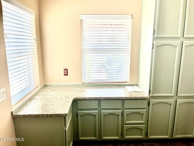 a bathroom with a window and a washer