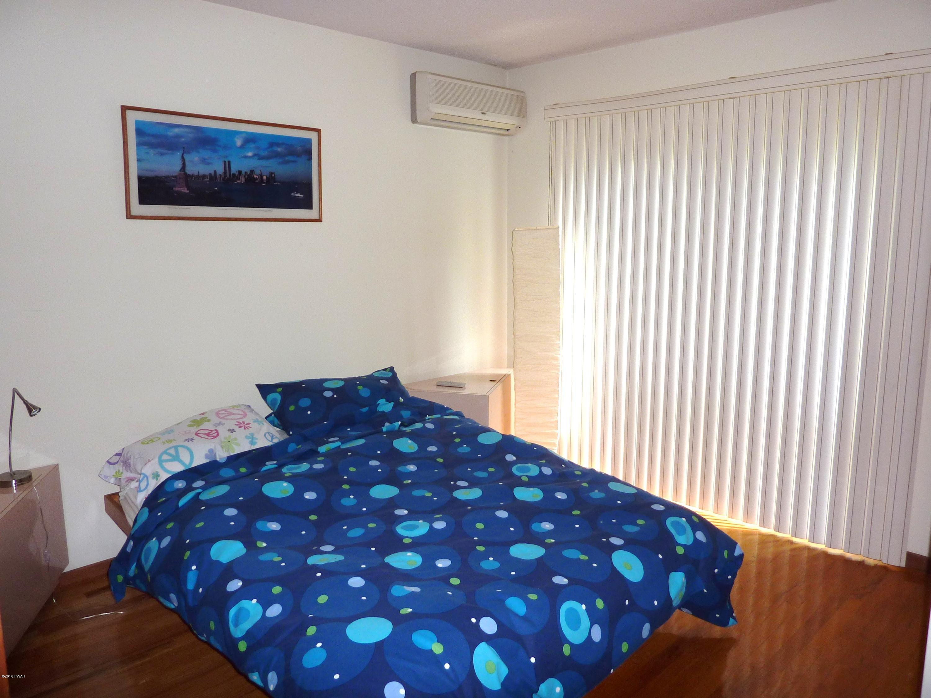 106 Valley Run Road Greentown, PA 18426 - Photo 20 of 21 a bedroom with a bed and a window