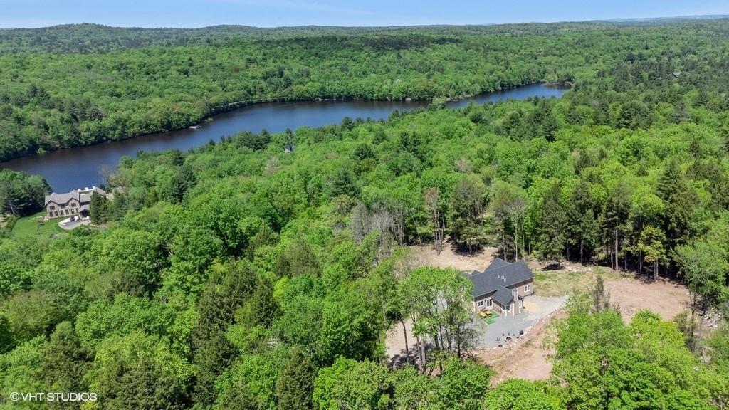836 Starlight Road Monticello, NY 12701 - Photo 12 of 50 a view of a lush green forest with houses