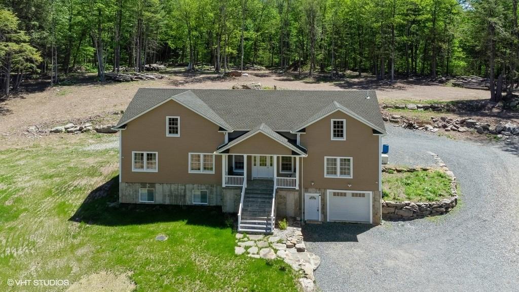 836 Starlight Road Monticello, NY 12701 - Photo 16 of 50 a front view of a house with a yard