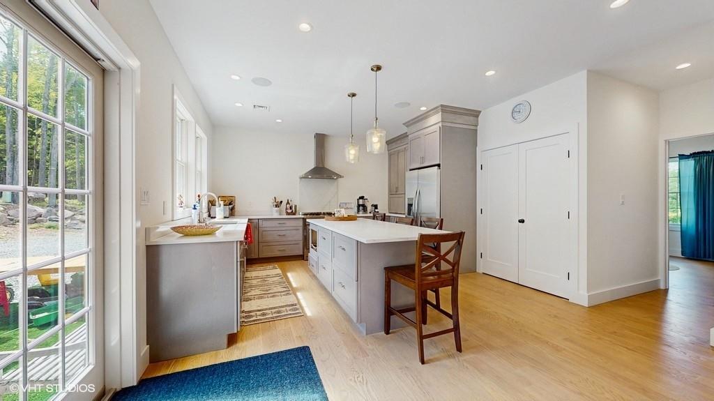 836 Starlight Road Monticello, NY 12701 - Photo 17 of 50 a large kitchen with a table and chairs
