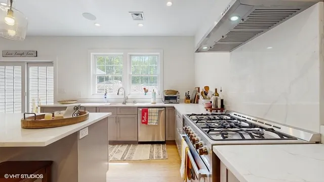 a kitchen with a stove and a sink