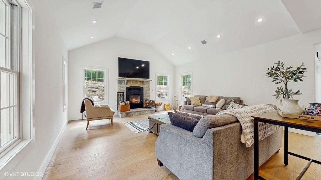 836 Starlight Road Monticello, NY 12701 - Photo 21 of 50 a living room with furniture a fireplace and a flat screen tv