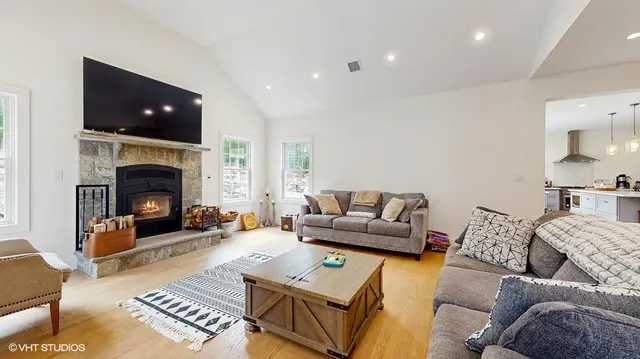 a living room with furniture and a fireplace