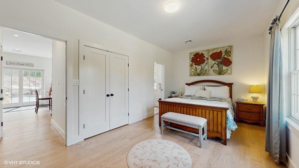 836 Starlight Road Monticello, NY 12701 - Photo 25 of 50 a bed room with a bed and a painting on the wall