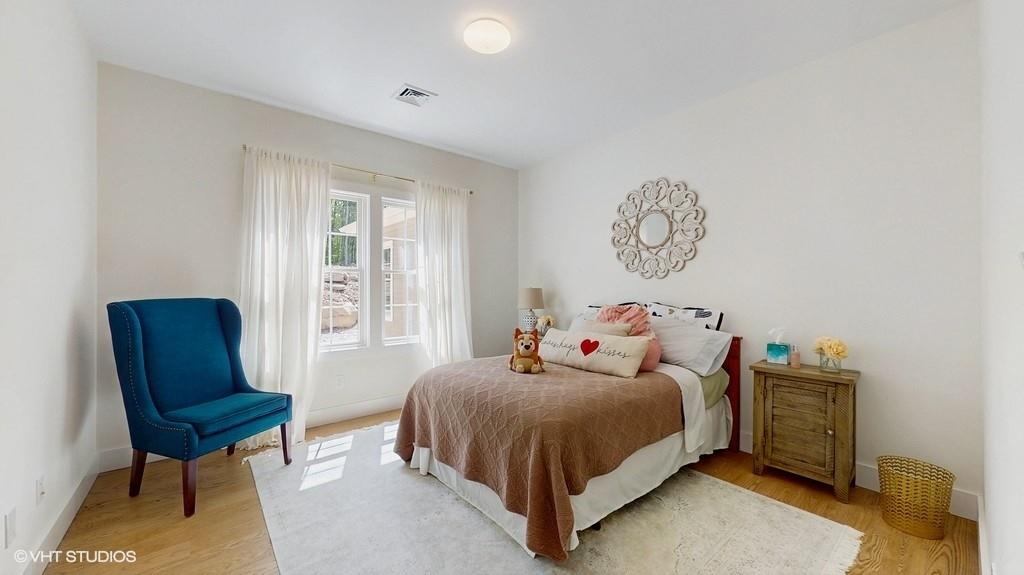 836 Starlight Road Monticello, NY 12701 - Photo 28 of 50 a bedroom with a bed and a chair