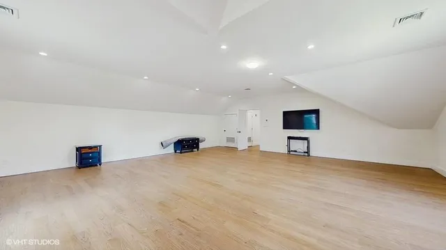 a view of an empty room with a cabinet