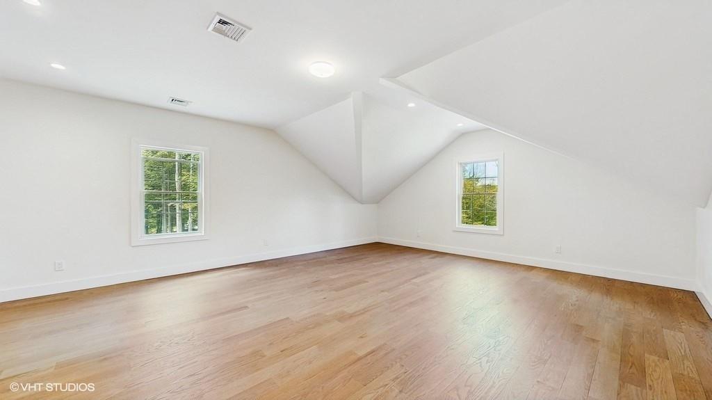 836 Starlight Road Monticello, NY 12701 - Photo 41 of 50 an empty room with wooden floor and windows