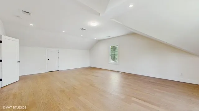 an empty room with a empty space and windows