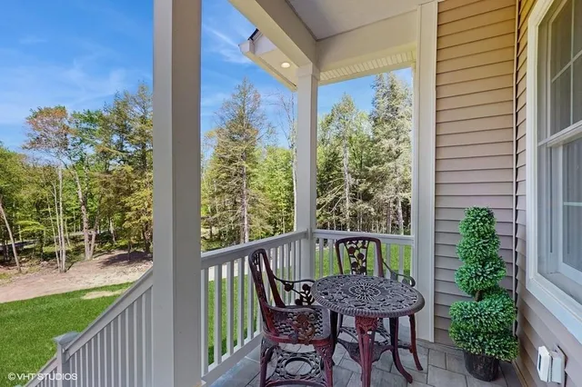 a view of a chair and table in the balcony