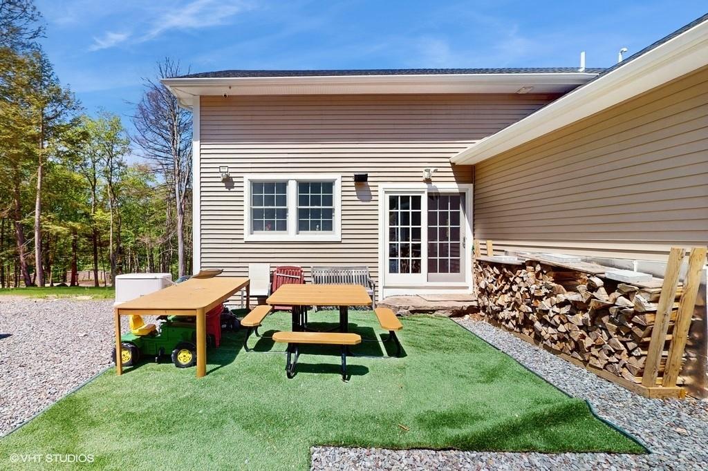 836 Starlight Road Monticello, NY 12701 - Photo 45 of 50 a backyard of a house with wooden fence and a bench