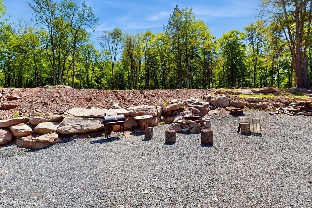 836 Starlight Road Monticello, NY 12701 - Photo 46 of 50 a view of a backyard with sitting area