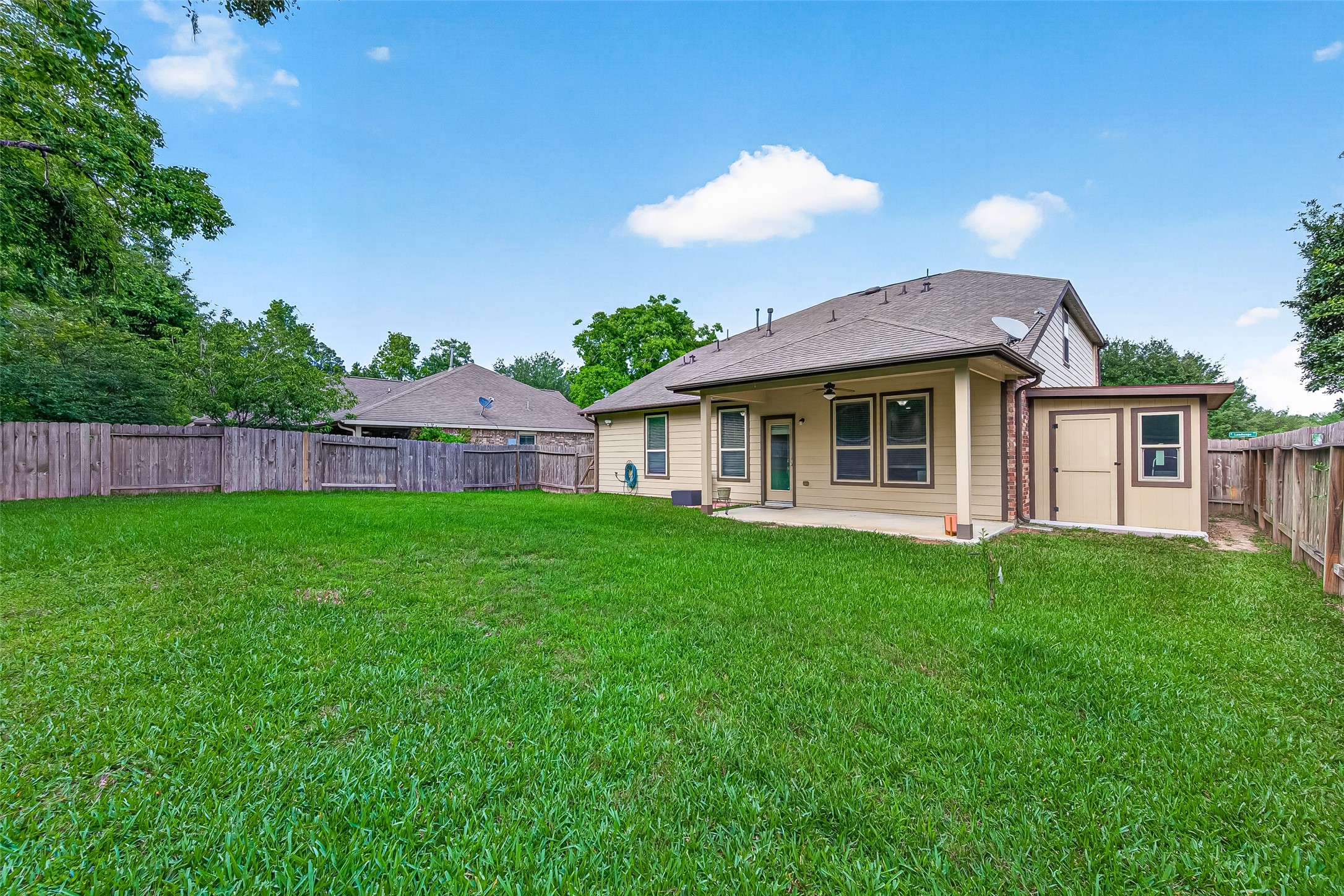 8 Landscape Court Conroe, TX 77301 - Photo 41 of 43 a view of a house with a backyard