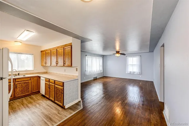 a bedroom with a large bed and a flat tv screen on dresser