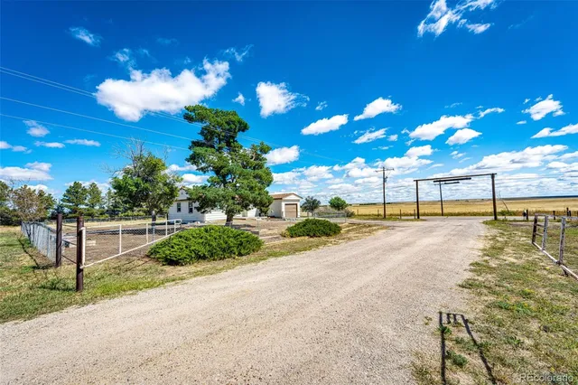 a view of a pool table and chairs