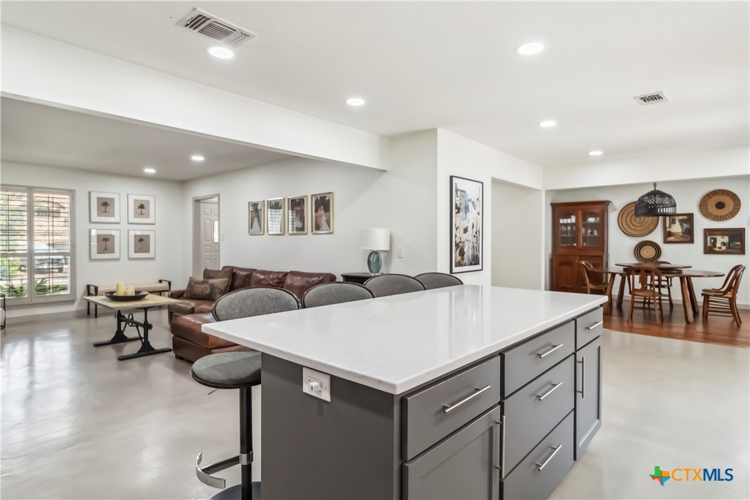 425 West Edgewater Terrace New Braunfels, TX 78130 - Photo 11 of 45 a living room with furniture a dining table and chairs
