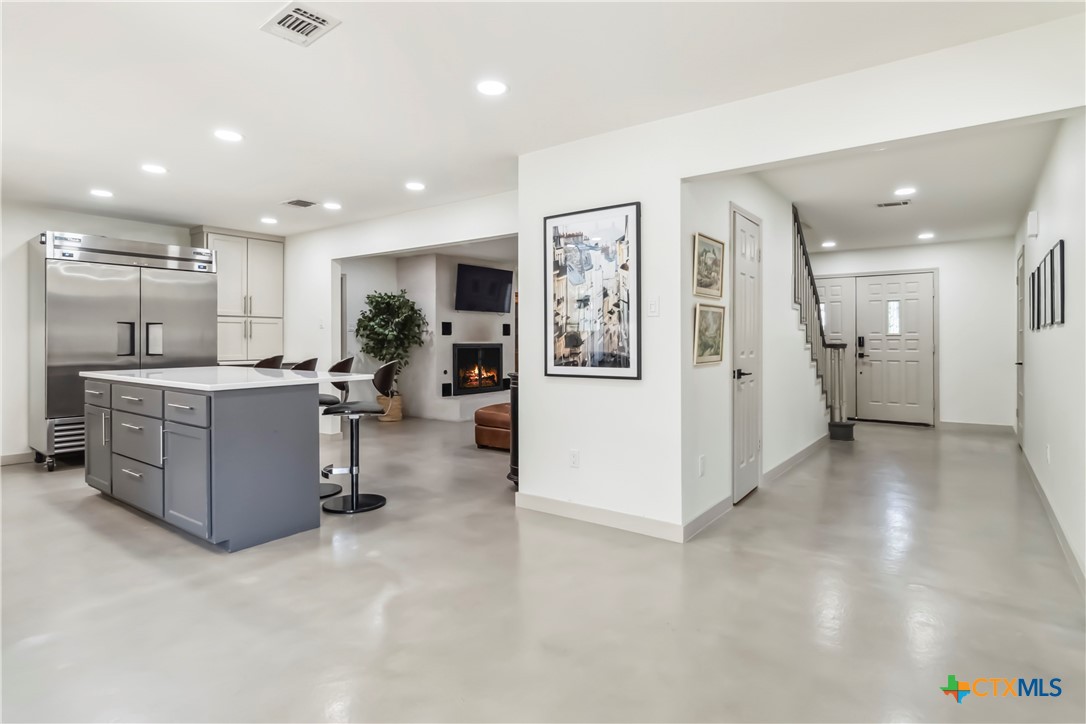 425 West Edgewater Terrace New Braunfels, TX 78130 - Photo 12 of 45 a kitchen with a refrigerator and a sink