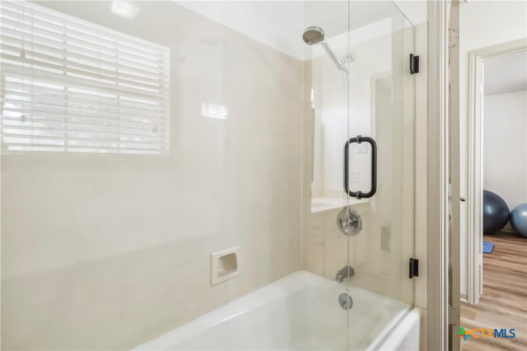 425 West Edgewater Terrace New Braunfels, TX 78130 - Photo 27 of 45 a bathroom with a shower and a bath tub