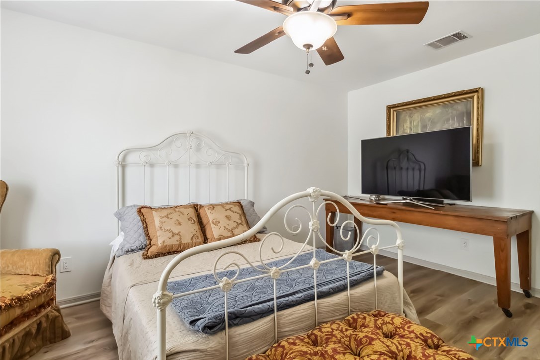 425 West Edgewater Terrace New Braunfels, TX 78130 - Photo 29 of 45 a bedroom with furniture and a flat screen tv