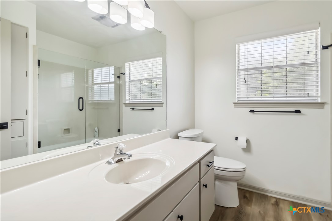 425 West Edgewater Terrace New Braunfels, TX 78130 - Photo 30 of 45 a bathroom with a sink a toilet and shower