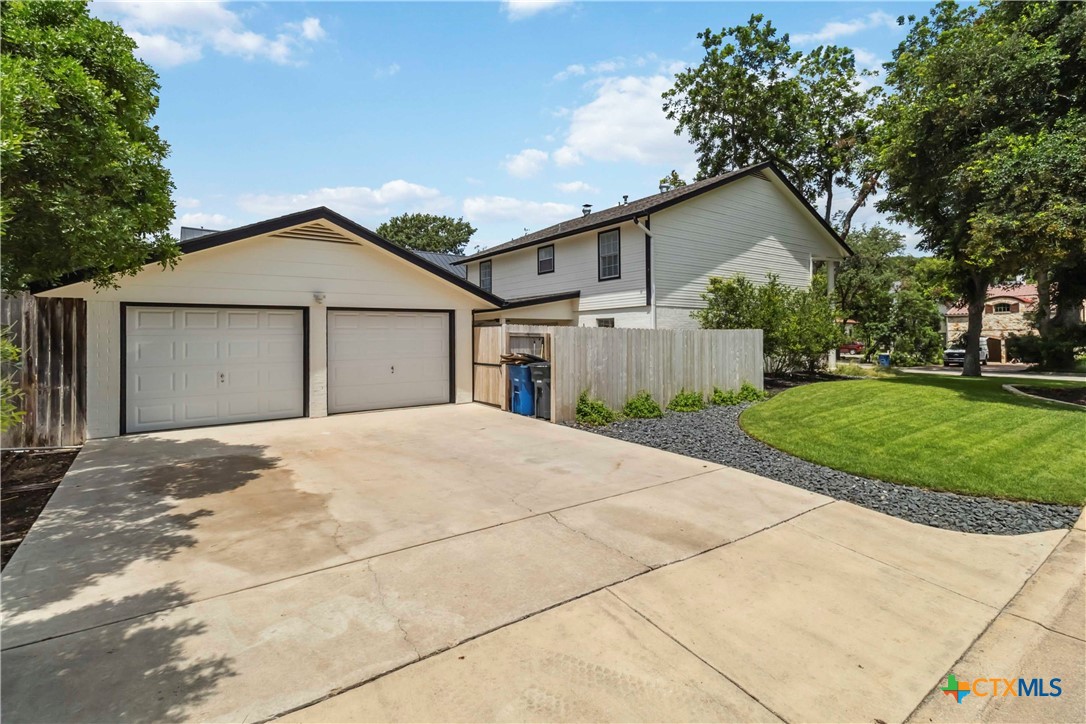 425 West Edgewater Terrace New Braunfels, TX 78130 - Photo 37 of 45 a view of a house with a yard and large tree
