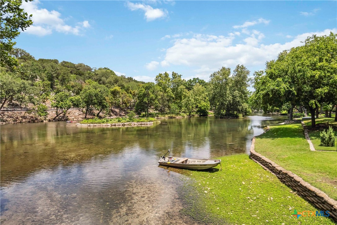 425 West Edgewater Terrace New Braunfels, TX 78130 - Photo 39 of 45 a view of a lake with a yard