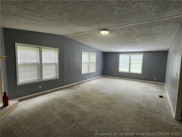 a view of empty room with windows