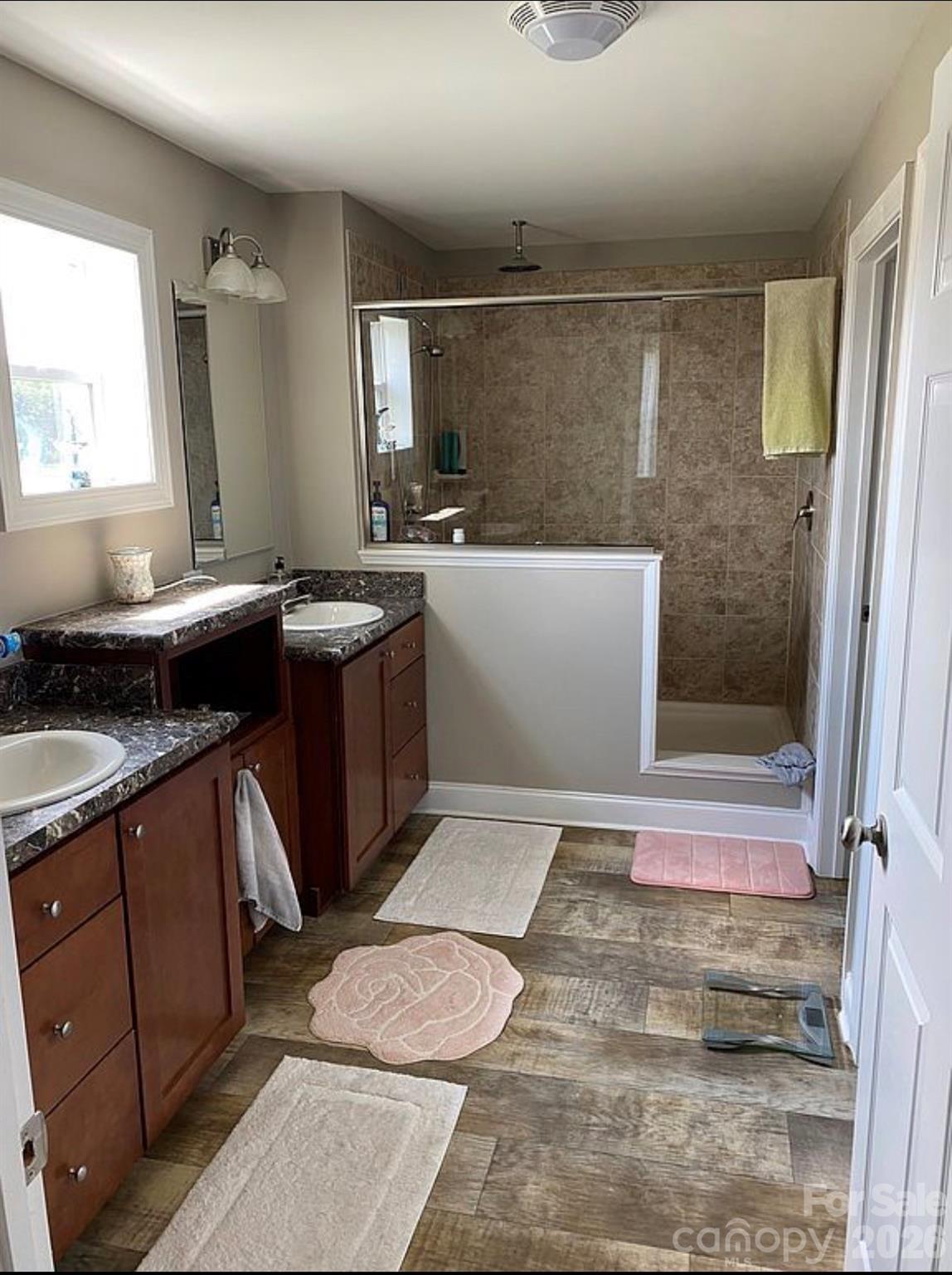 6042 Heavner Road Vale, NC 28168 - Photo 26 of 27 a bathroom with a sink and a mirror