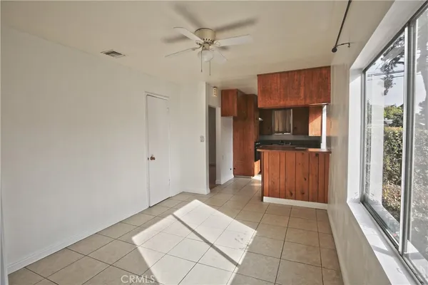 a view of a kitchen with refrigerator and cabinet