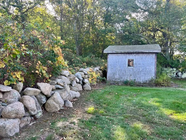 a kitchen with refrigerator a microwave and a sink