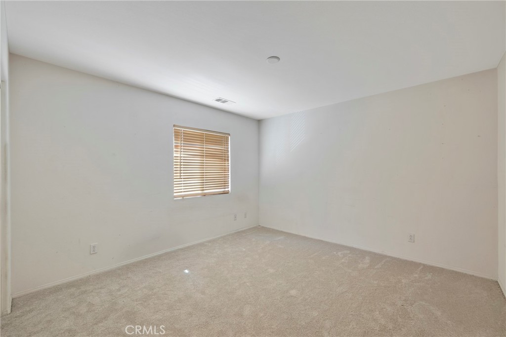 3819 St Austell Way Perris, CA 92571 - Photo 37 of 64 an empty room with a window