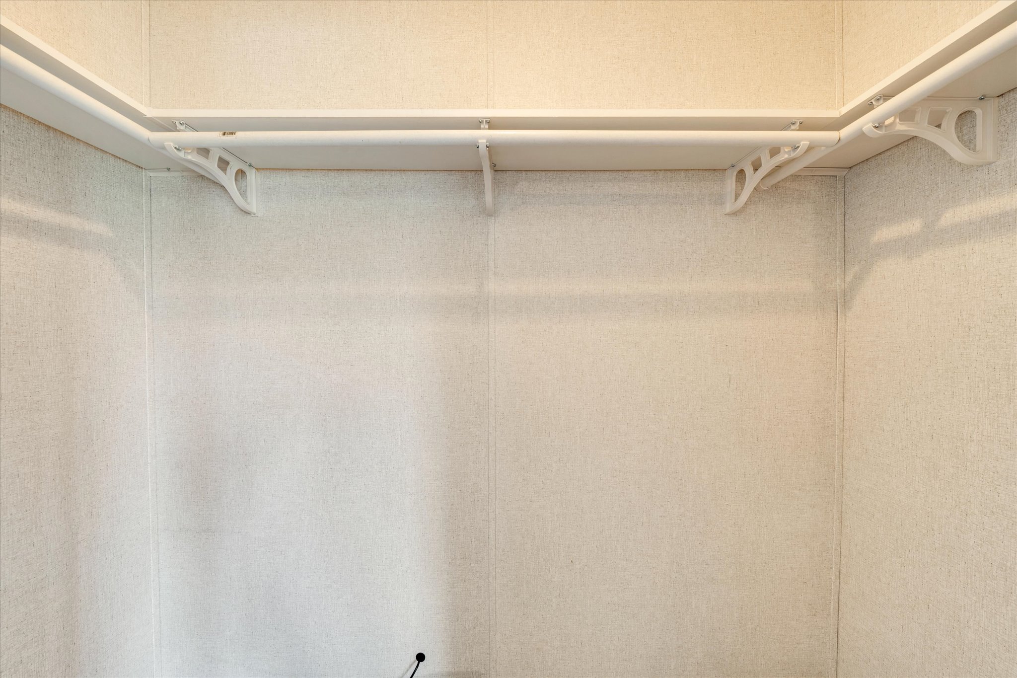 1500 Wattsville Road Luling, TX 78648 - Photo 15 of 38 Ample hanging space with robust corner shelving enhances this well-appointed closet.
