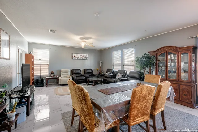 a living room with lots of furniture and a flat screen tv
