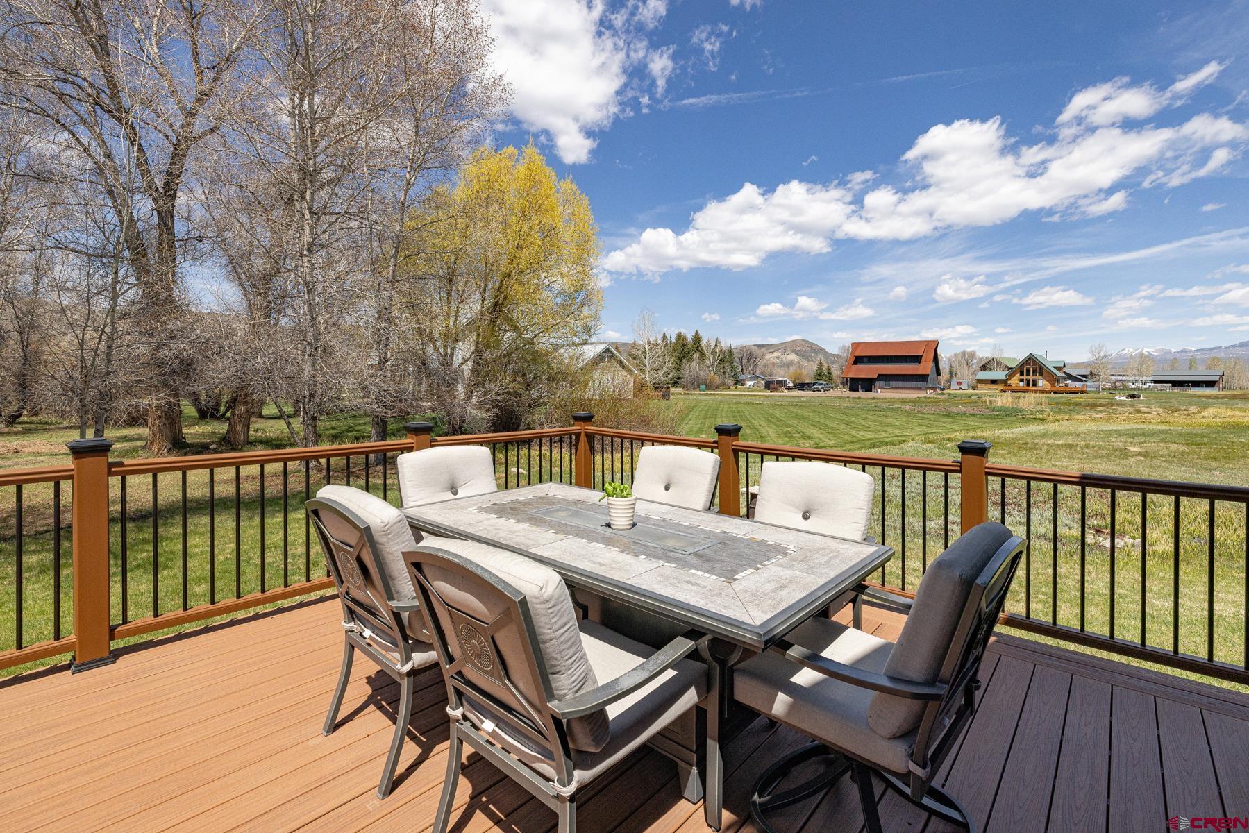 389 Apache Road Gunnison, CO 81230 - Photo 20 of 43 a view of a balcony with two chairs and a table