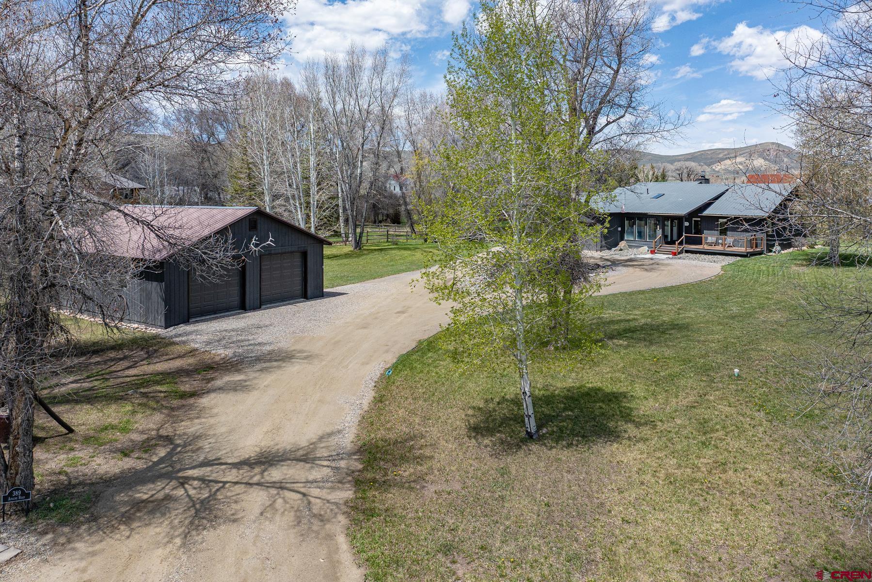 389 Apache Road Gunnison, CO 81230 - Photo 2 of 43 a view of a house with a yard
