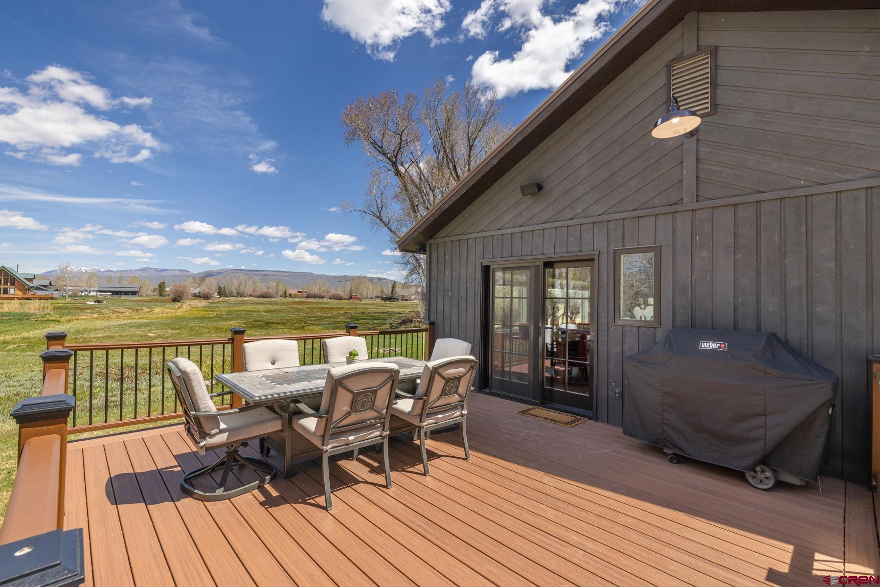389 Apache Road Gunnison, CO 81230 - Photo 21 of 43 a view of a patio with table and chairs