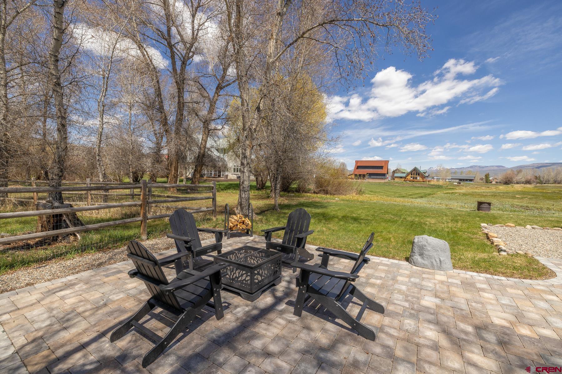 389 Apache Road Gunnison, CO 81230 - Photo 23 of 43 a view of a lake with outdoor seating