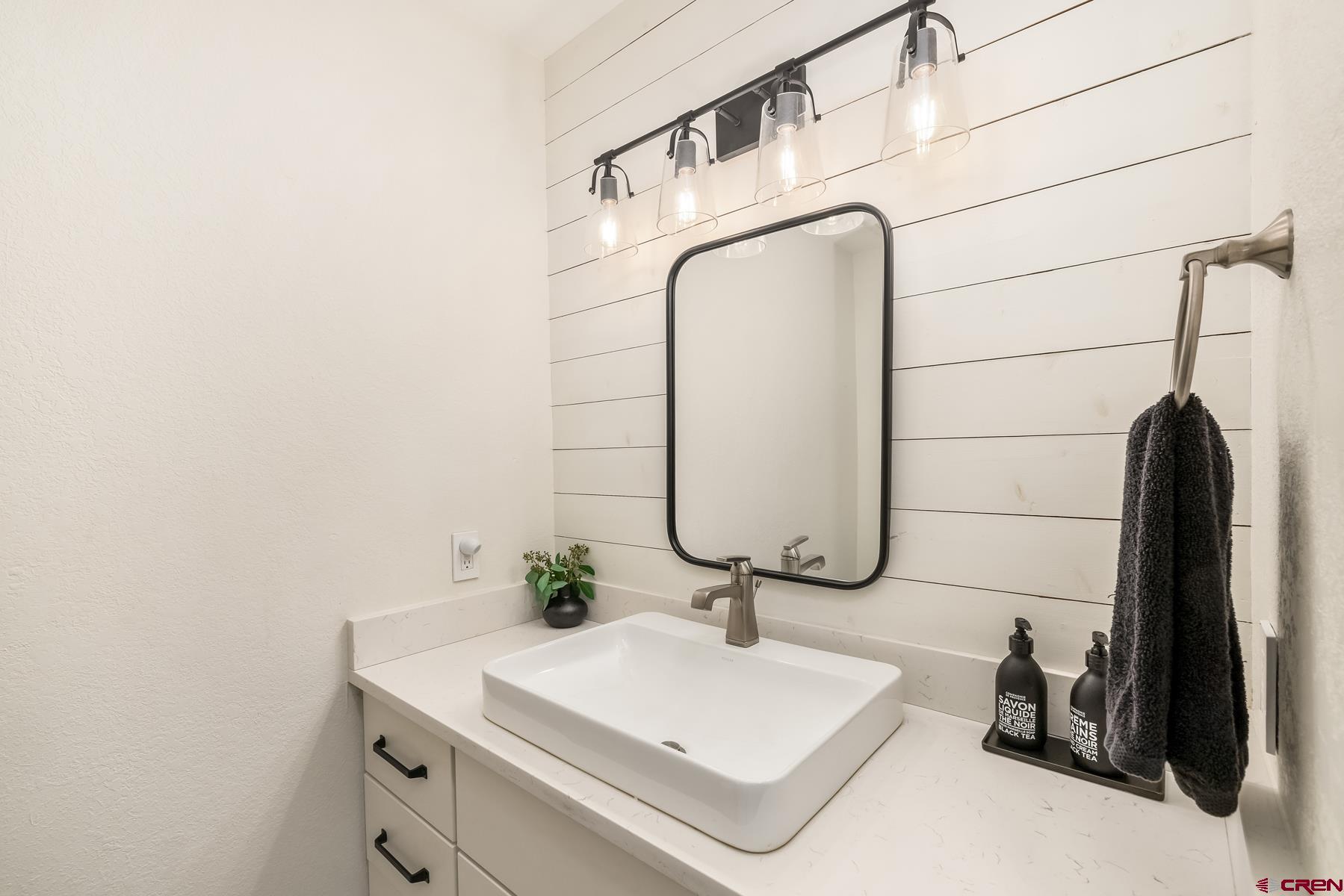 389 Apache Road Gunnison, CO 81230 - Photo 25 of 43 a bathroom with a sink and a mirror