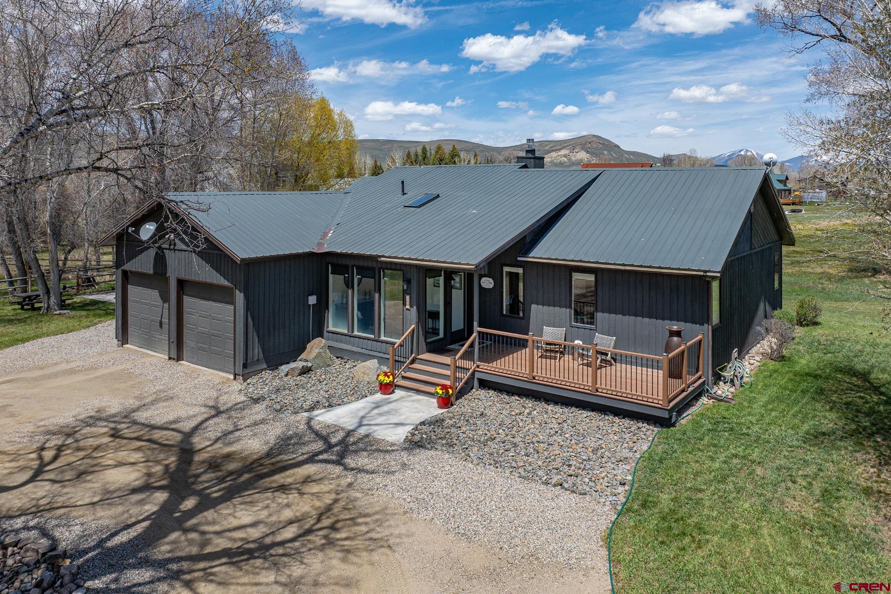 389 Apache Road Gunnison, CO 81230 - Photo 3 of 43 a view of a house with backyard and sitting area