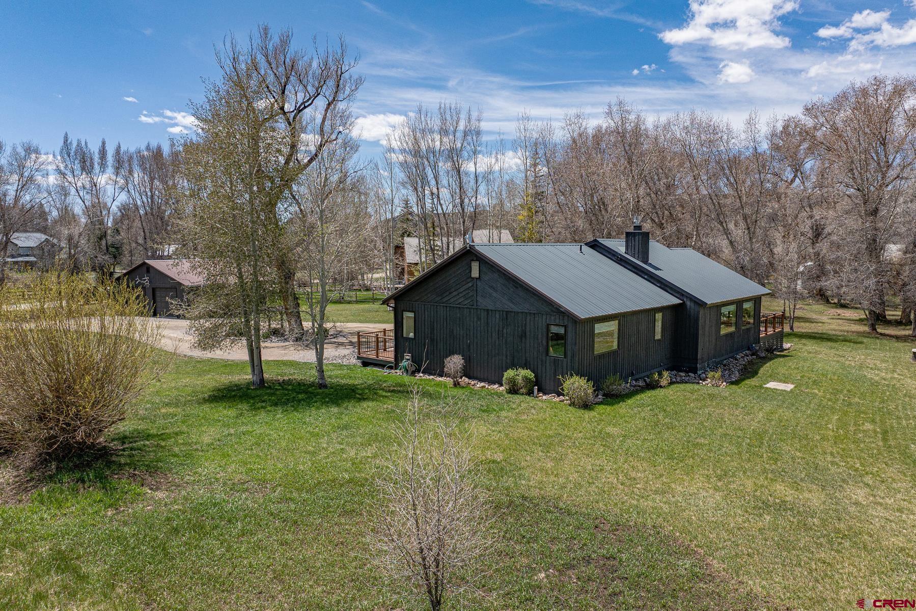 389 Apache Road Gunnison, CO 81230 - Photo 38 of 43 a view of a house with a yard