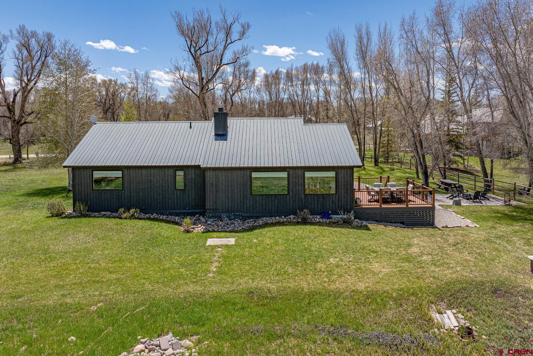 389 Apache Road Gunnison, CO 81230 - Photo 39 of 43 a view of a house with swimming pool and sitting area