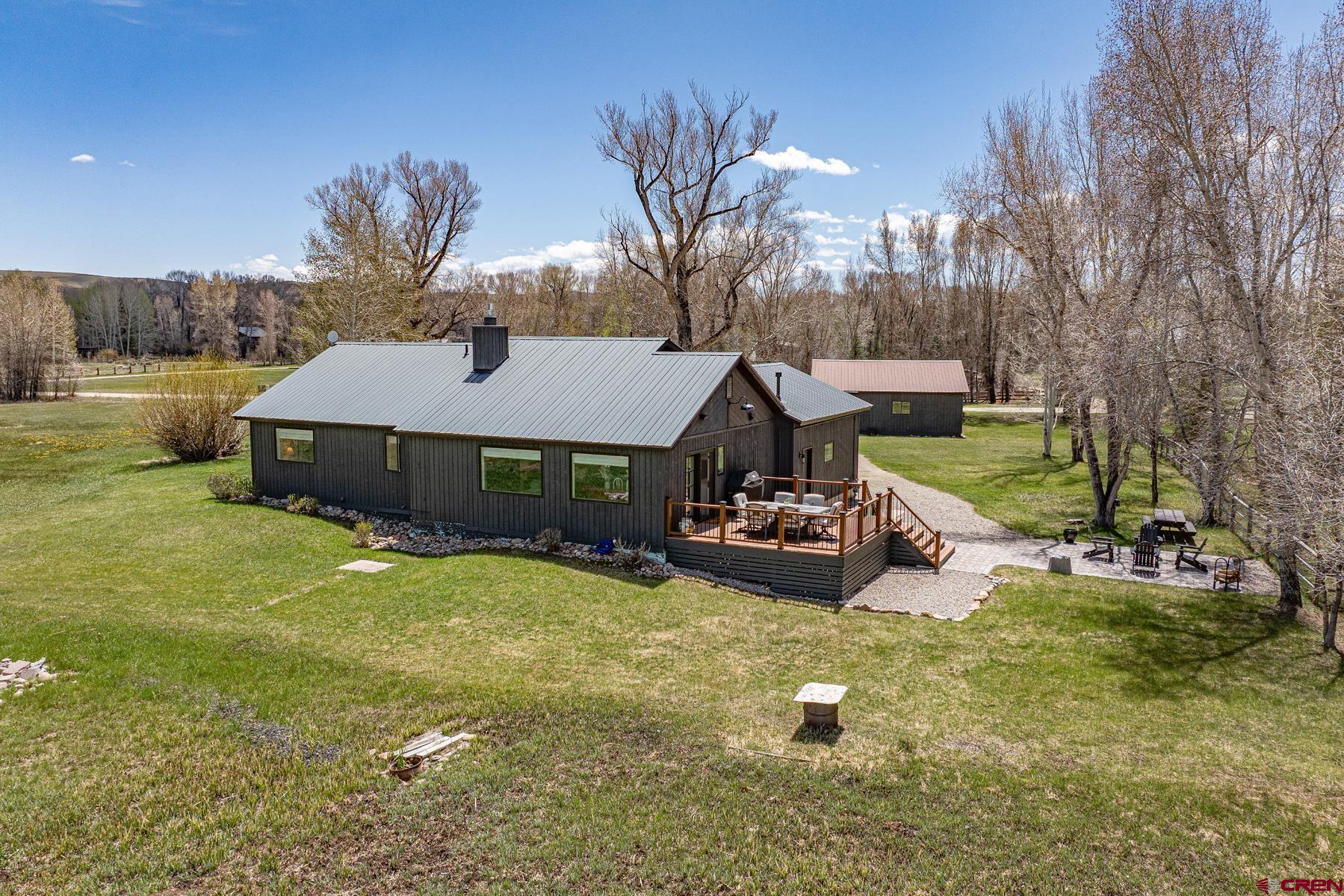 389 Apache Road Gunnison, CO 81230 - Photo 40 of 43 a front view of a house with garden