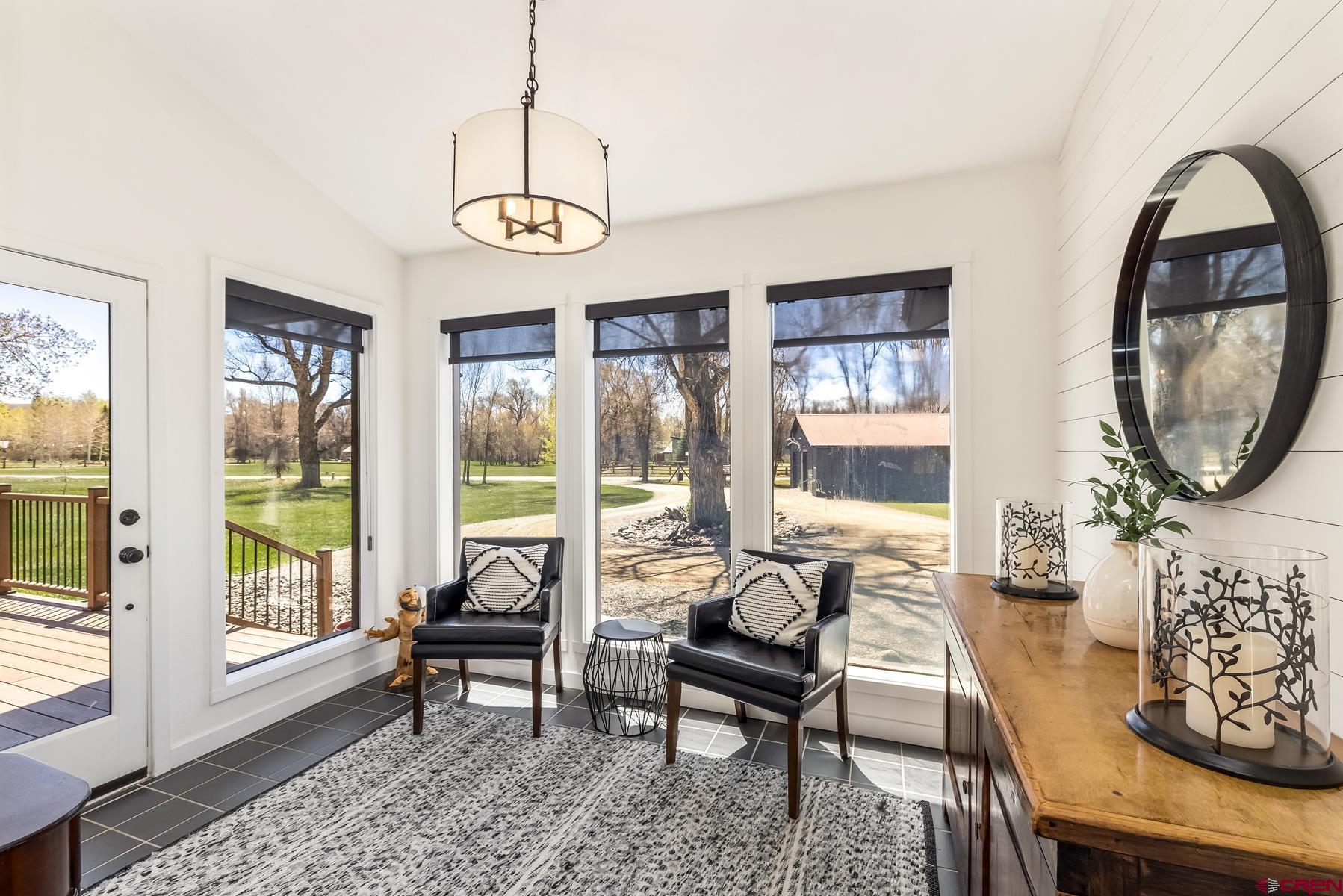 389 Apache Road Gunnison, CO 81230 - Photo 4 of 43 a living room with furniture and a large window