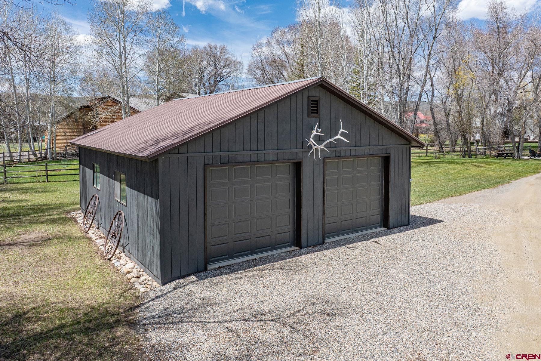 389 Apache Road Gunnison, CO 81230 - Photo 42 of 43 a house with a yard
