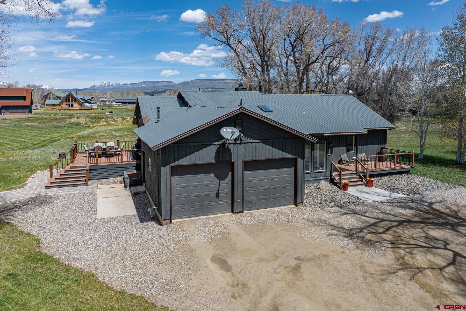 389 Apache Road Gunnison, CO 81230 - Photo 43 of 43 a house view with a backyard space