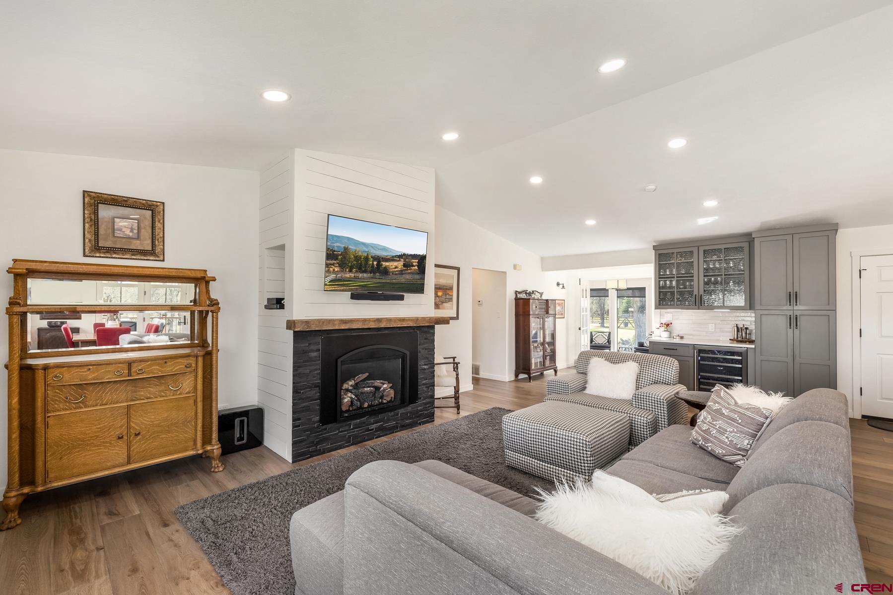 389 Apache Road Gunnison, CO 81230 - Photo 9 of 43 a living room with furniture and a fireplace
