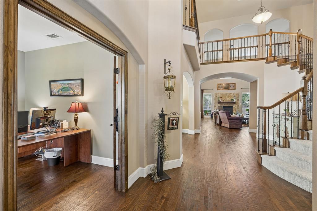 8104 Red Riv Run North Richland Hills, TX 76180 - Photo 3 of 38 a view of a livingroom with wooden floor and furniture